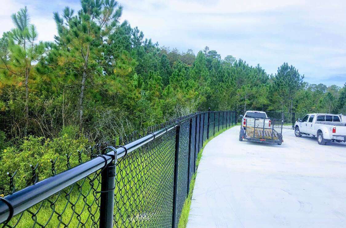 Chain link fence installation for commercial lot